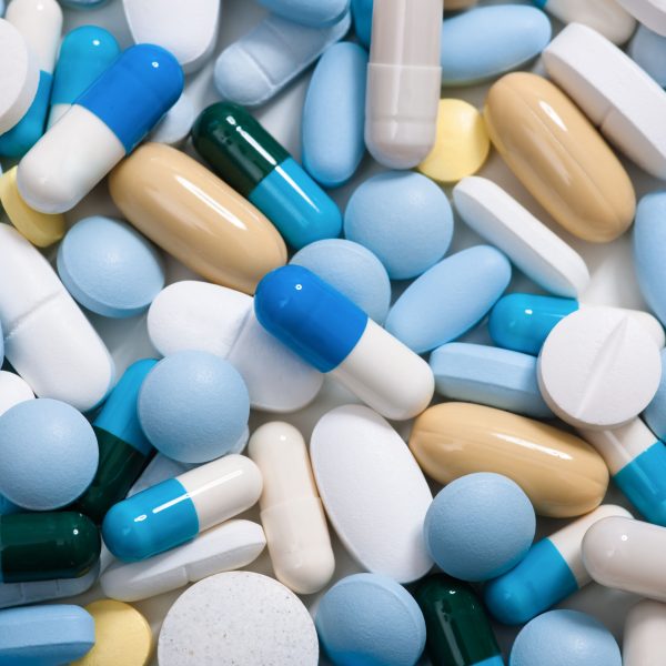 23132291 - heap of medicine pills   background made from colorful pills and capsules